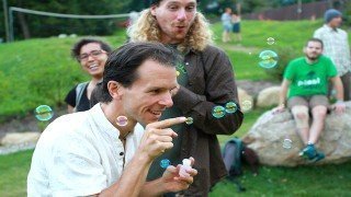 Dr. Samuel Mielcarski pokes bubbles next to Chris Kendall at The Woodstock Fruit Festival
