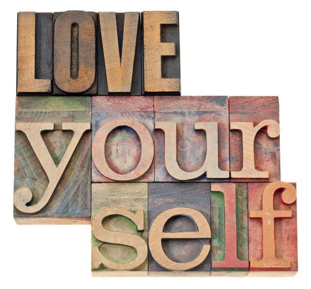 The words "Love Yourself" in wood type