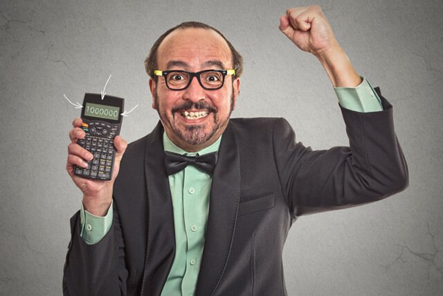 Happy businessman showing calculator with 1 million figure