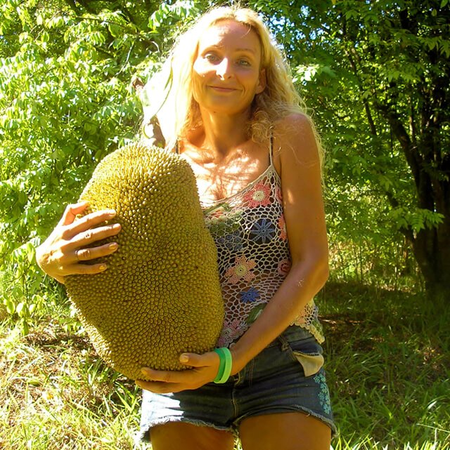 Anne Osborne holds a large jackfruit she foraged in February 2014