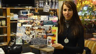 Deanna Husk holds a vision board she created