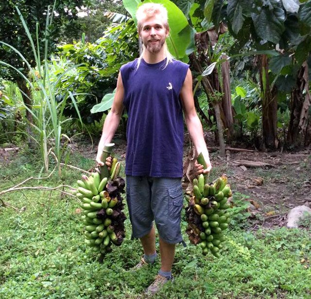Jason Kvestad holds bananas in both hands