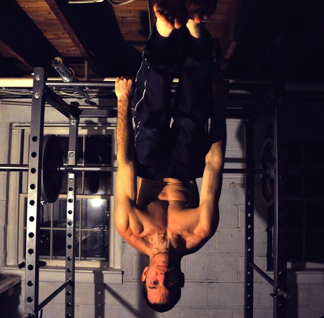 Korey Constable performs shoulder shrugs