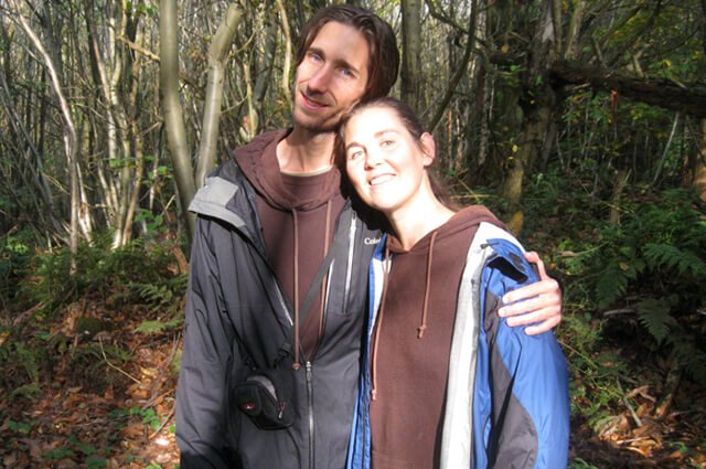 Reny Kattel and Jesse Bogdanovich are photographed in a wooded area