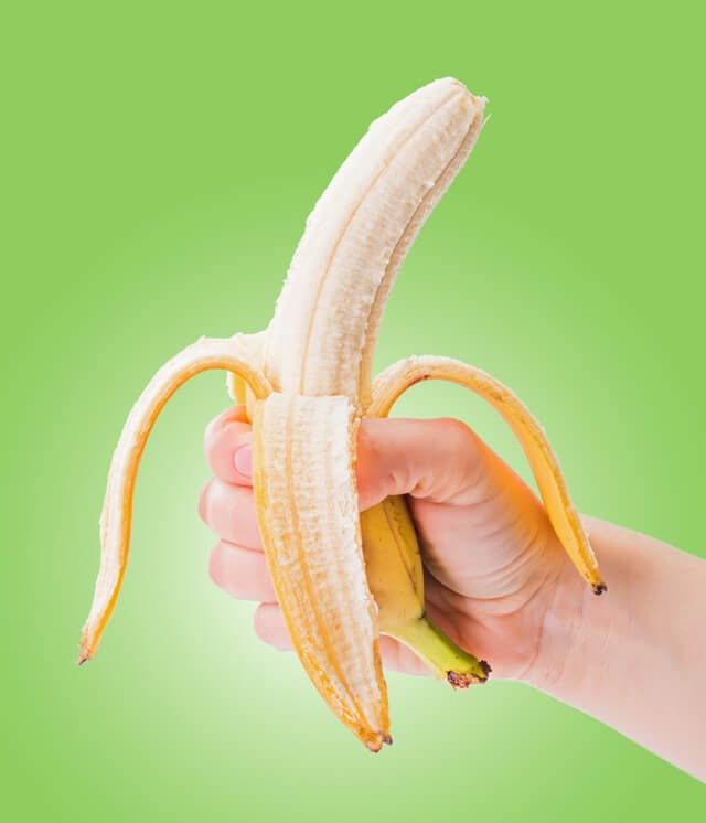 A peeled banana in hand