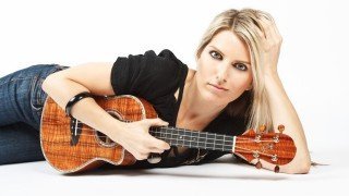 Alicia Grant poses while holding a ukelele