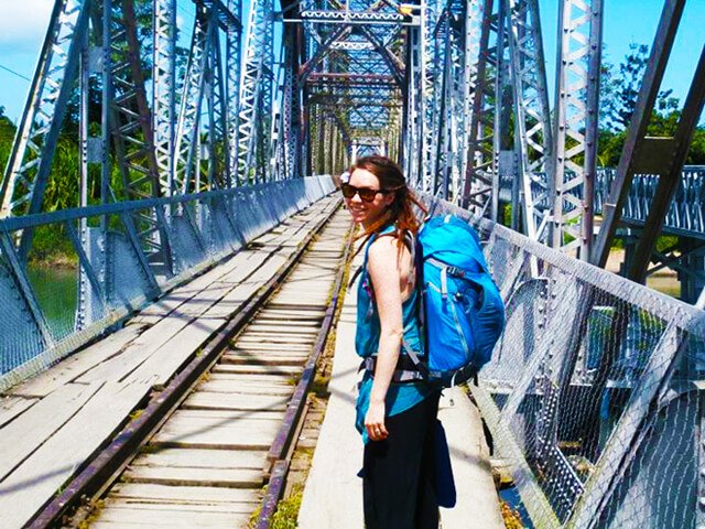 Brittany Taylor walks on a bridge