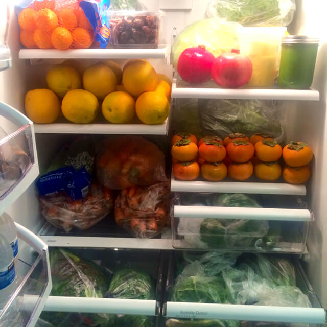 John Fallucca's refrigerator, full of fruits and vegetables