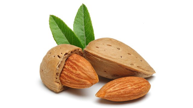 Almonds whole and shelled on a white background
