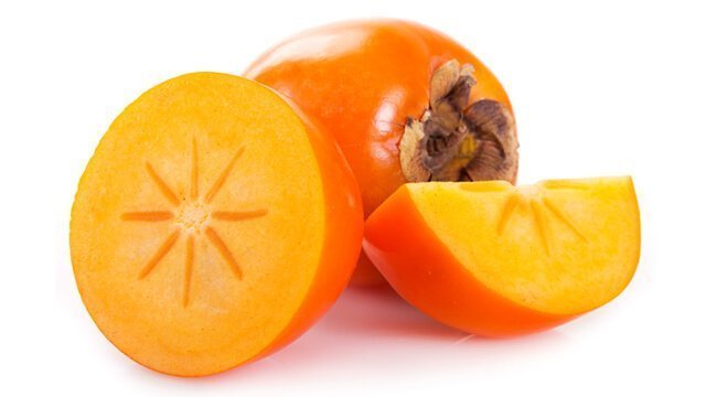 Persimmons whole and sliced open