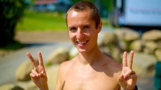 Ted Carr gives peace signs at the 2014 Woodstock Fruit Festival