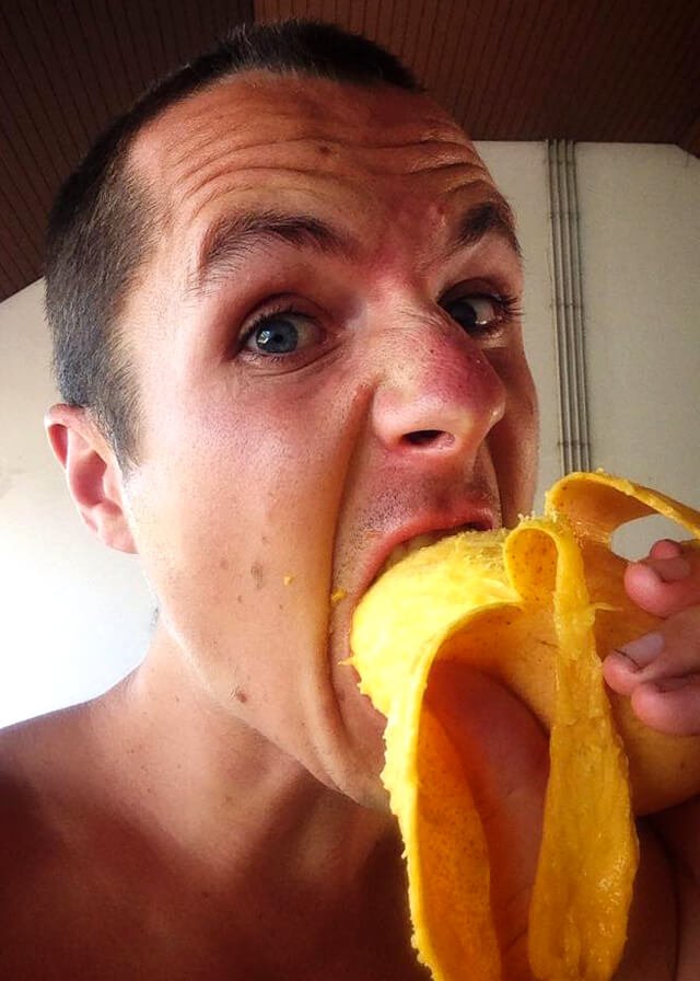 Ted Carr eats a mango