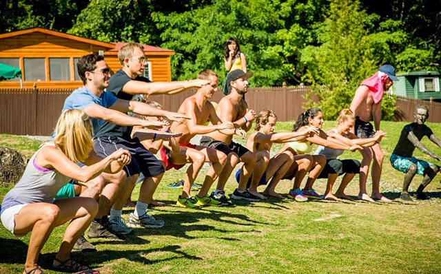 Ted Carr leads a squatting challenge