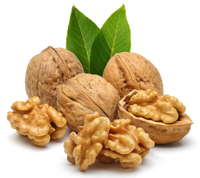 Walnuts whole and shelled with leaves