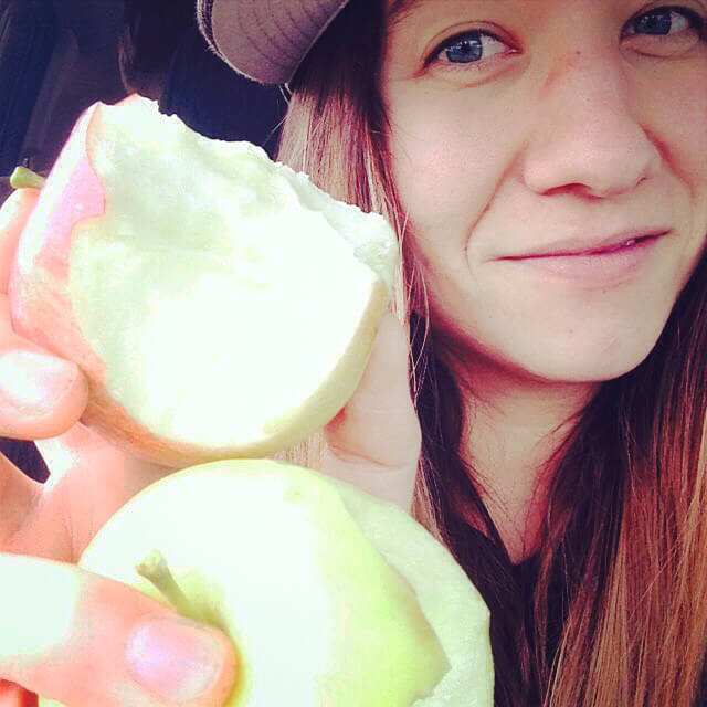Apryl Electra Storms eating two apples simultaneously