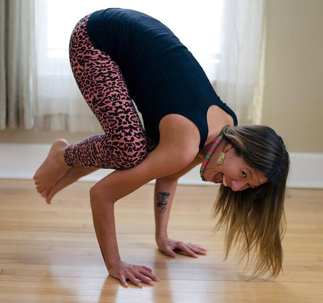 Apryl Electra Storms practices crow pose