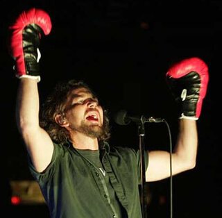 Pearl Jam's Eddie Vedder wears "Rocky" boxing gloves to kick off the final show at the Spectrum in Philadelphia in 2009.