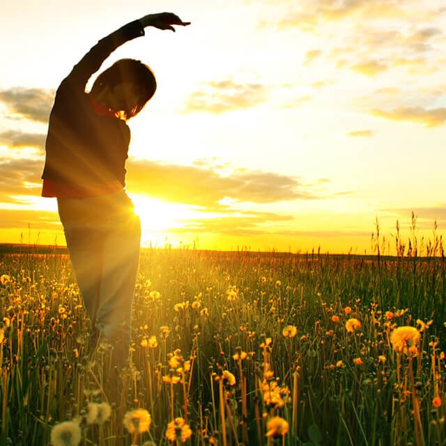 Young woman under sunset light