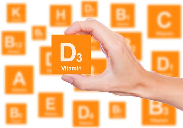 A woman lifts a Vitamin D3 block