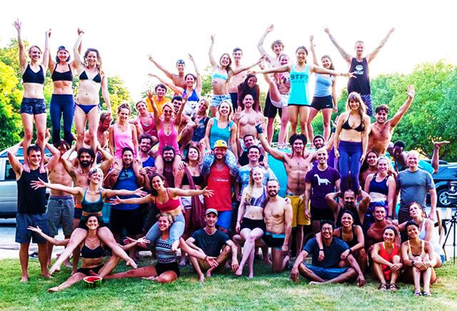 Brittany Taylor participates in a large acro party