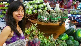 Mewsum Wong buys food in a produce aisle