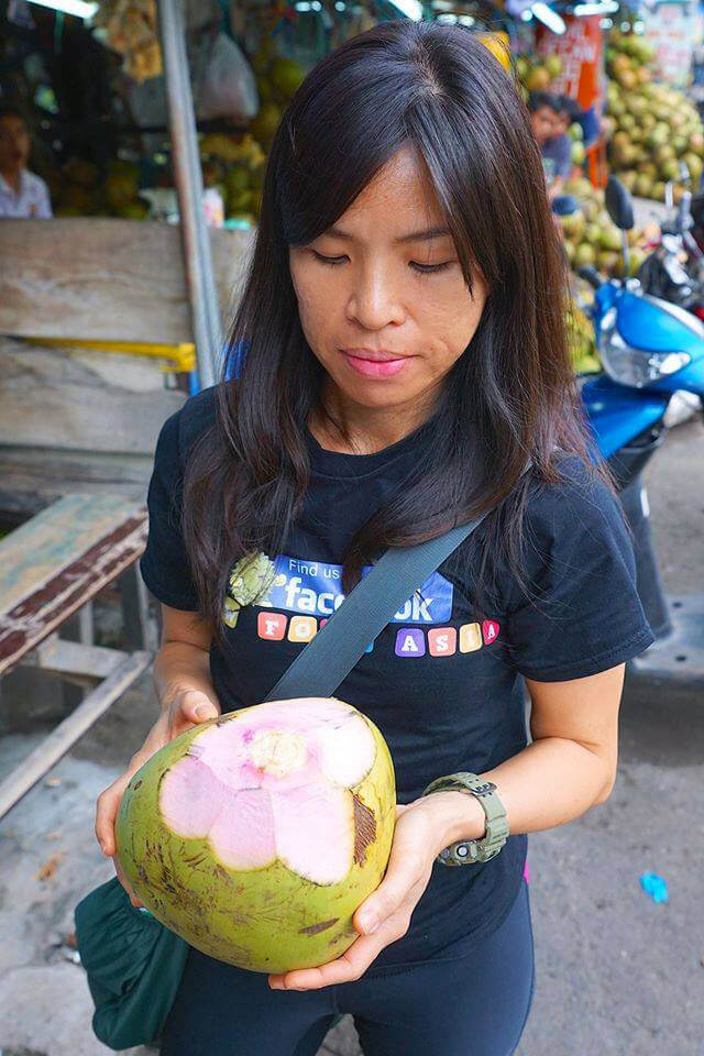 Mewsum Wong holds a coconut