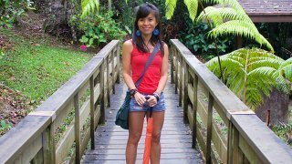 Mewsum Wong smiles while standing on a nature path