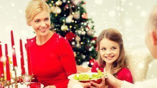 A family shares salad during a Christmas meal