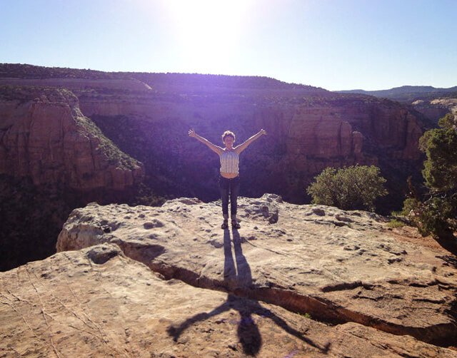 Katy Craine poses after summitting a mountain in 2010