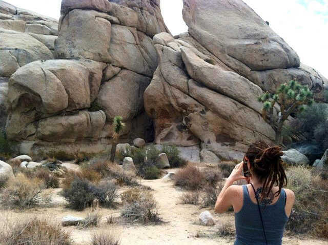 Brittany Taylor snaps a photograph at Joshua Tree