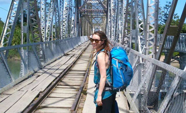 Brittany Taylor crosses a bridge at the Costa Rica-Panama border