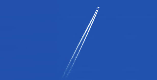 A plane sprays chemtrails