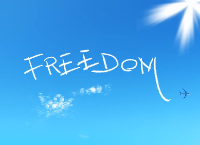 The word freedom is written in the sky as chemtrails