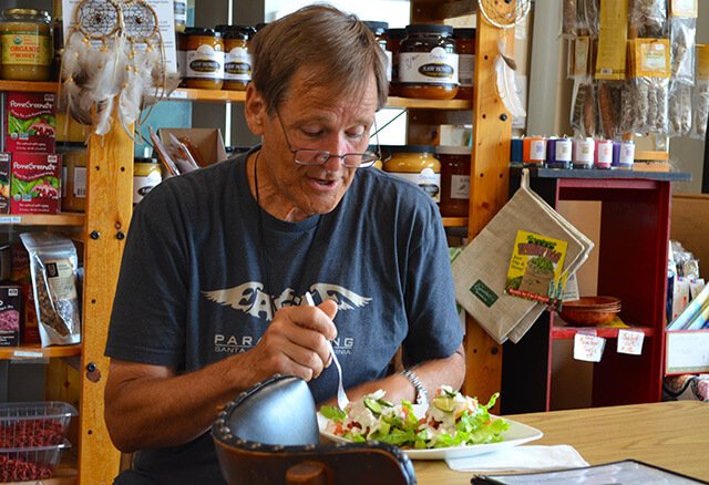 Don Croft enjoys a Cheezeberger Sandwich at Arnold's Way