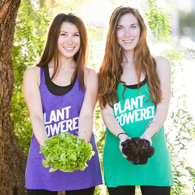 Rawthenticity's Lori Weiss and Nicole Gregg hold lettuce outside