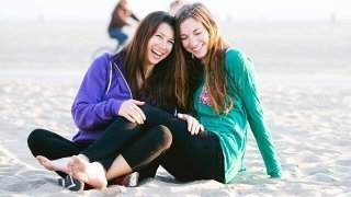 Rawthenticity's Lori Weiss and Nicole Gregg relaxing on a beach