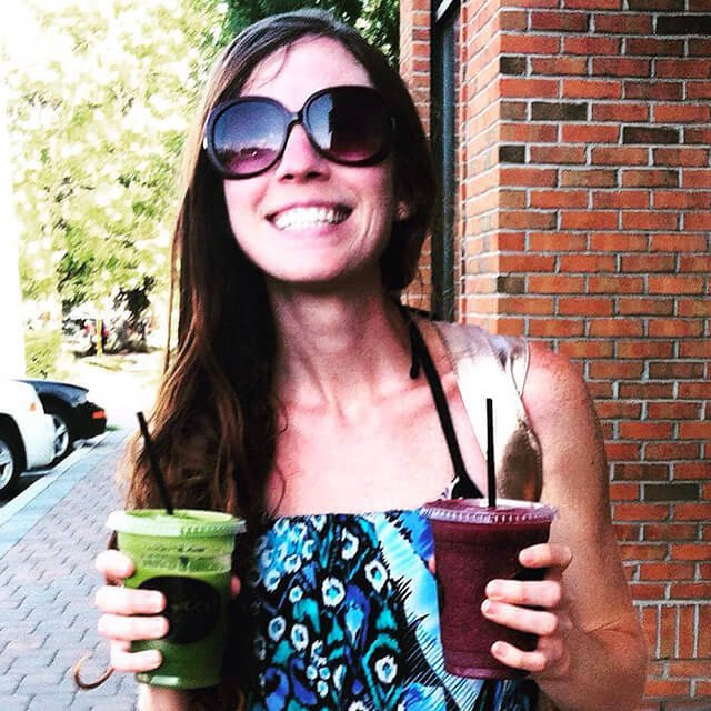 Rawthenticity's Nicole Gregg holds a pair of smoothies