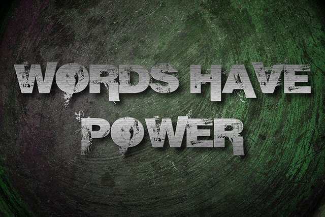 "Words Have Power" written on a green-and-gray canvas
