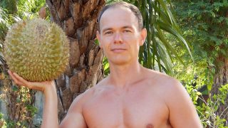 Petr Cech hoists a durian in Koh Lanta