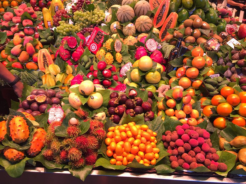 A display of colorful fruits from around the world at a market in Europe