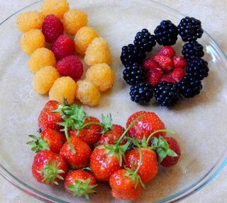 Brightly colored berries on a plate
