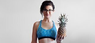 Melissa Raimondi holds a pineapple
