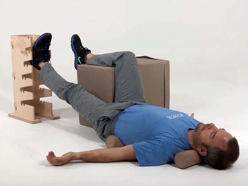 A demonstration of the Egoscue Method exercise Supine Groin Progressive on Towels