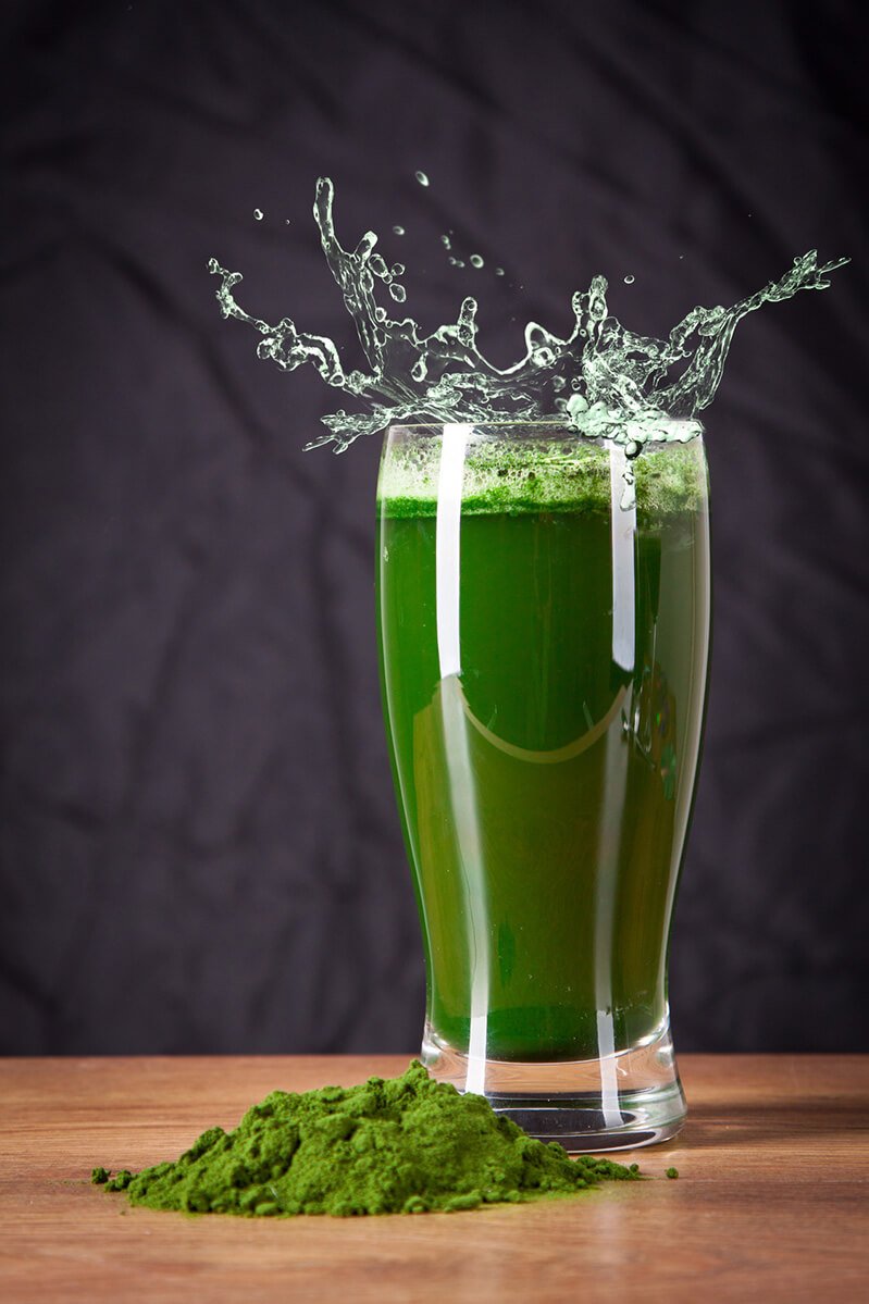 A glass of barley grass juice powder mixed with water