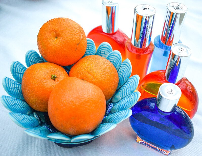 Oranges in a blue bowl with orange and blue Color Mirrors