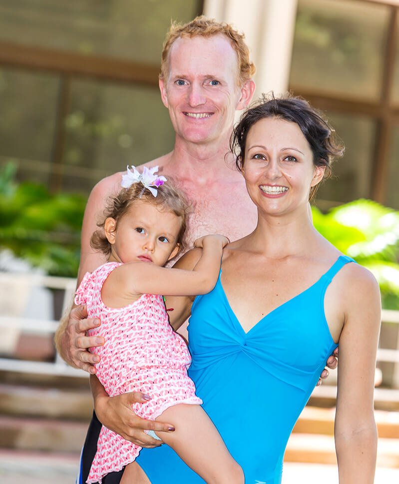 Yulia Tarbath holds Elanie Tarbath beside Paul Tarbath