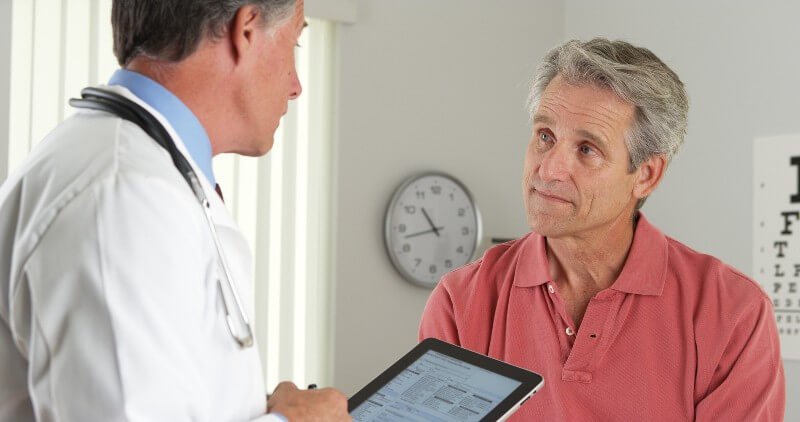 Doctor talks to a male patient