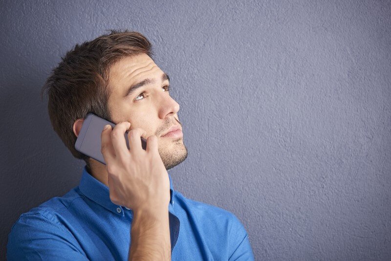 A man talks on a cell phone