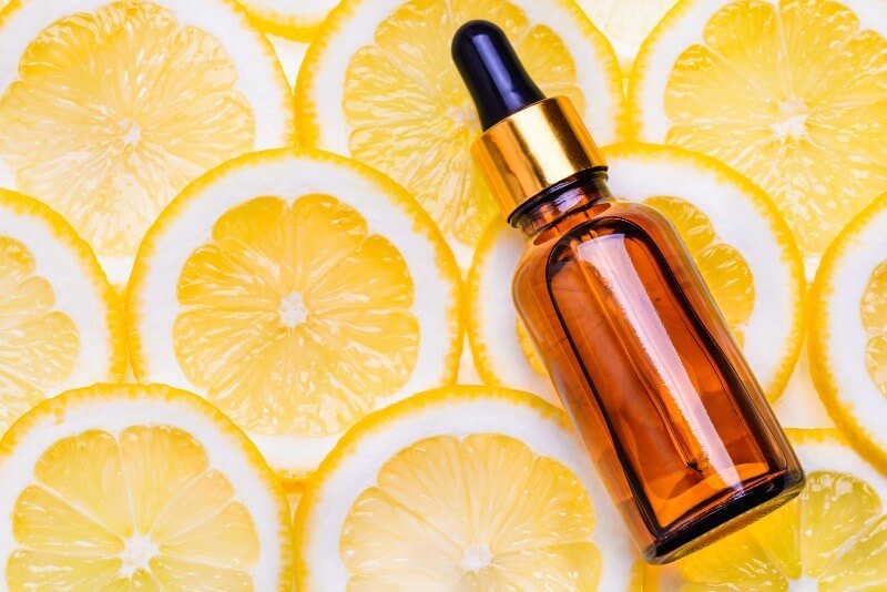 Orange essential oils photographed on orange slices
