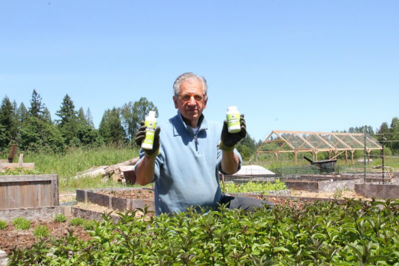 Uncle Harry's Natural Products founder Harry Terhanian holds two of his favorite products from his company's line